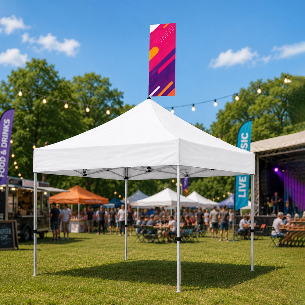 White canopy tent at an outdoor festival